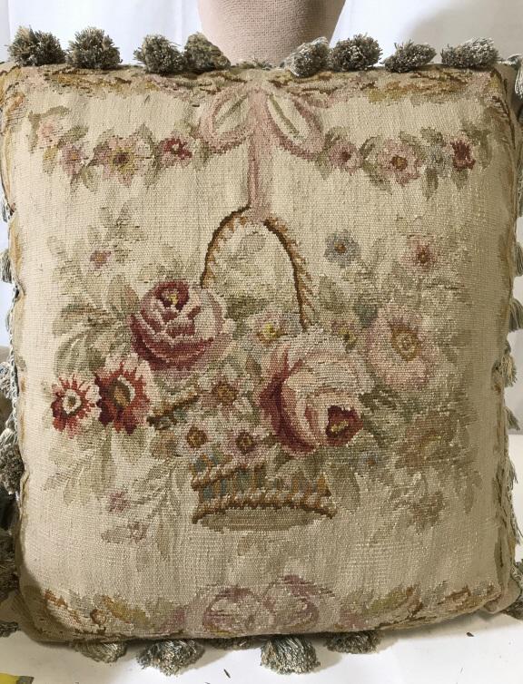 Pair vintage Wool Aubusson Pillows: Pair Vintage Wool woven 20x 20 in pillows, front depicts roses and other flowers in a basket. Has tassel piping, backside velour fabric. Removable cover, fabric flap over zipper, stuffed with poly fil
