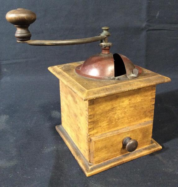 Antique Wooden Coffee Grinder: This piece is an antique coffee grinder, the piece may be used for grinding things such as spices as well. The piece measures approx 8.5 inches H and 5.75 inches W. There is some wear present on the p