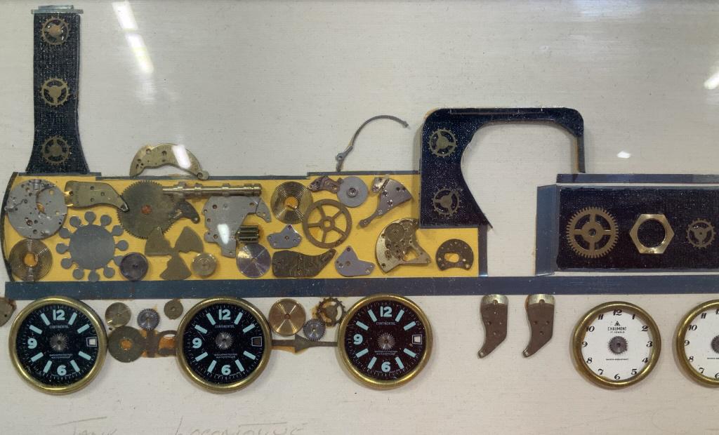 Framed Horological KENNETH BROADBENT Clock Collage: This piece is a signed clockwork collage, the piece is signed in the lower right hand corner of the work. The signature is illegible, the piece comes form KENNETH BROADBENT and is made in England. The