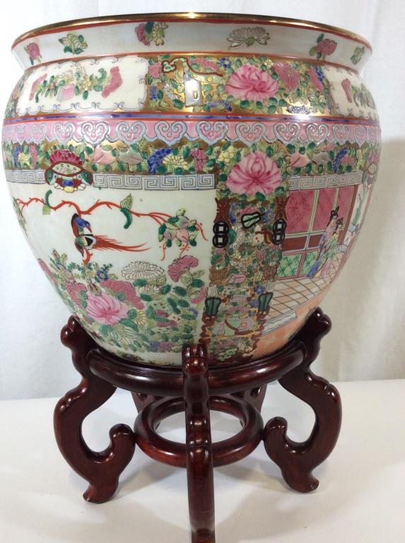 Chinese Porcelain Rose Medallion Planter On Stand: SIGNED Chinese Floor Planter ( Underside red stamp with Chinese Characters and has sticker reads Made in China. Heavily decorated porcelain with reticulated lei-wen , Greek key pattern, peacocks, lotu