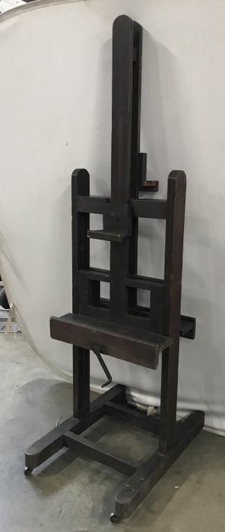 Double Sided 19th Century English Antique Easel: Large double sided 19th Century English antique artist easel. Easel is wooden. Easel is on casters and has fully working winding handle for height adjustment. Piece appears to possibly have hand craft