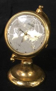 Vintage SUNBEAM World Map Brass tnd Clock: Vintage sunbeam brass clock, the face of the clock is decorated with a map of the world. The piece appears to be crafted from brass. The piece measures approx 2.8 inches H, and 1.5 inches in W. There