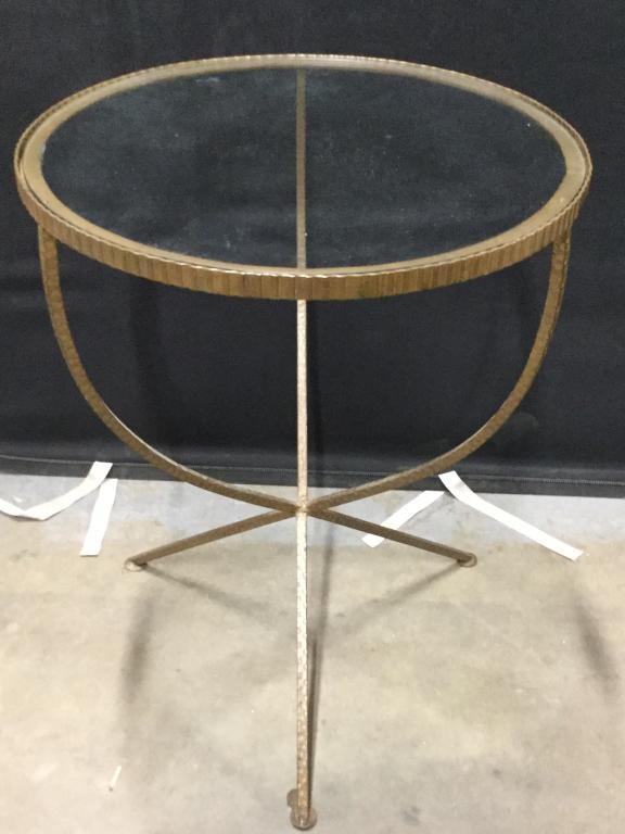Gilded Bronze Glass Top Bistro Table: Clear glass top, 21 in diameter. Rubber stoppers under glass for support and stability. Glass lifts out. Ht 27 1/4 in. Hammered pattern on metal legs. INddor side table, end table, bistor table, occas