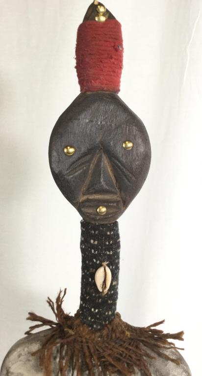Floor Sz Namaji Doll Mixed Media Figural, Nigeria: West African Sculptural Wood Doll Figural. Hand carved and painted blue, red & yellow ceremonial skirt, washed patina stripe pattern upper body. Accented with metal decor, including rounded brass tack