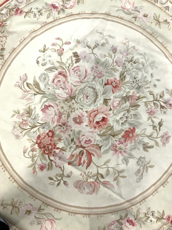 Handmade French Round Aubusson Rug: Rug is handmade. Appears to be wool. Rug is round in shape. Piece had intricate multi toned floral vine & leaf detail. Handmade rug, vintage rug, French rug, round rug, rug, carpet, area rug, Aubusson