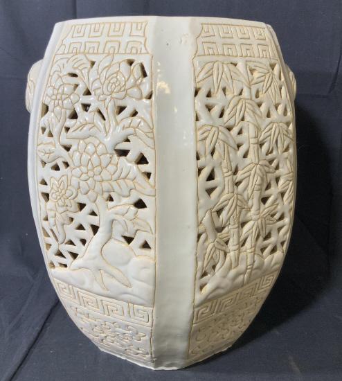 Vintage Asian Style Ceramic Garden Stool: This is a vintage, Asian, ceramic garden stool. The piece measures approx 16.5 inches H and 15 inches W. The piece is cream colored and decorated with carved detailing of flowering trees. There is wea
