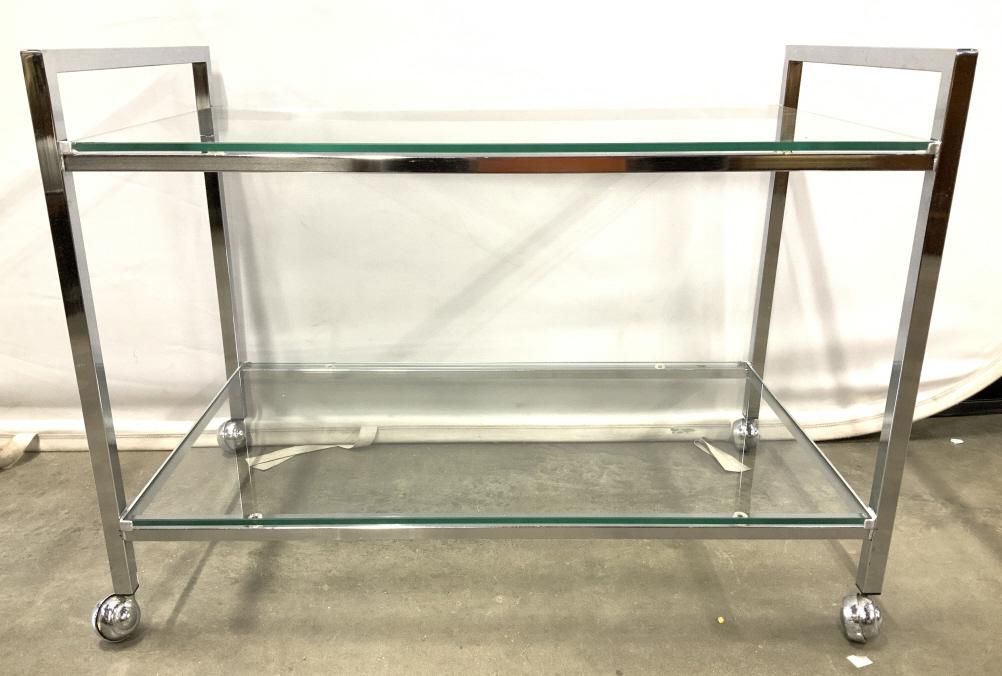 Vintage 2 Level MCM Chrome Bar Cart w Wheels: Mid Century Modern Bar Cart,Bar cart is chrome. Piece has 2 glass shelves. Piece sits on 4 wheels. Cart has handle on each side. Bar cart, vintage bar cart, industrial modern, chrome bar cart, 2 tier 
