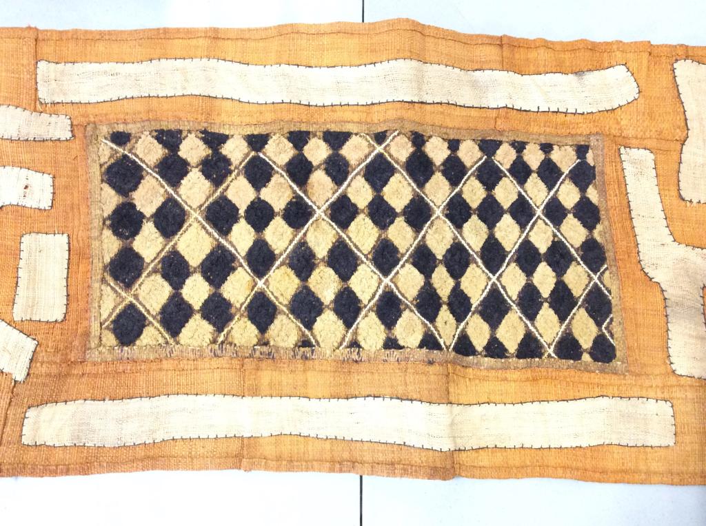 African KUBA Raffia Tapestry, Congo: Handmade raffia Tapestry/ furniture cover/ table runner/ wall hanging. Center shaved Raffia in diamond checkerboard pattern. Raffia Patchwork Decor stitching throughout. Dyed colors black, orange, & n