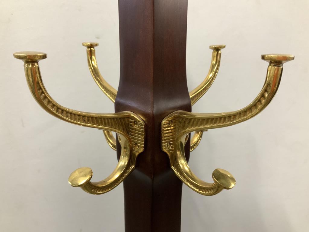 Standing Wooden 16 Hook Coat Rack: Coat rack is wooden. Piece is possibly vintage. Piece has 16 hooks, 8 large & 8 small. Coat rack, hat rack, wooden hat rack, wooden coat rack. Piece measures approximately 72 inches tall 18 inches wid