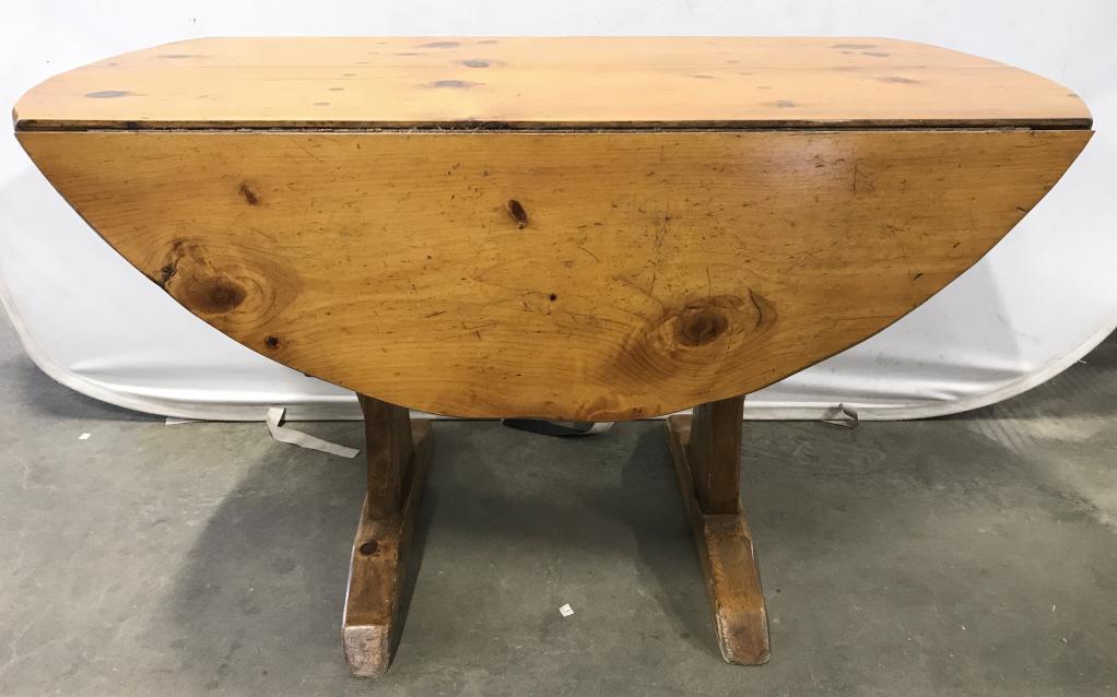 Vintage Carved Pine Drop Leaf Dining Table: Dining table appears to be pine. Piece has 2 drop leafs. Piece appears to possibly be hand crafted. Table mead approximately 29 inches tall 48 inches wide when fully extended. Dining table, pine table