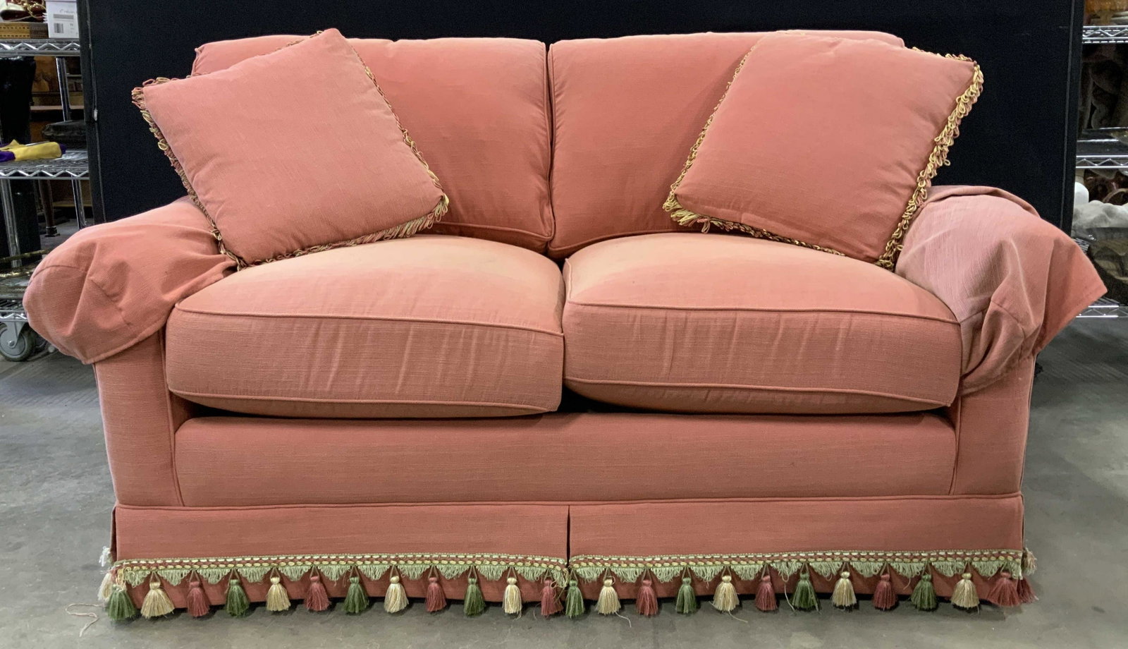 Vintage CALICO CORNERS Skirted Loveseat: Tag on underneath cushions reads CALICO CORNERS FURNITURE. Loveseat is skirted. Skirt has multi toned tassels at end. Sofa has coral tone. Piece includes 2 pillows. Loveseat, skirted loveseat, sofa, s