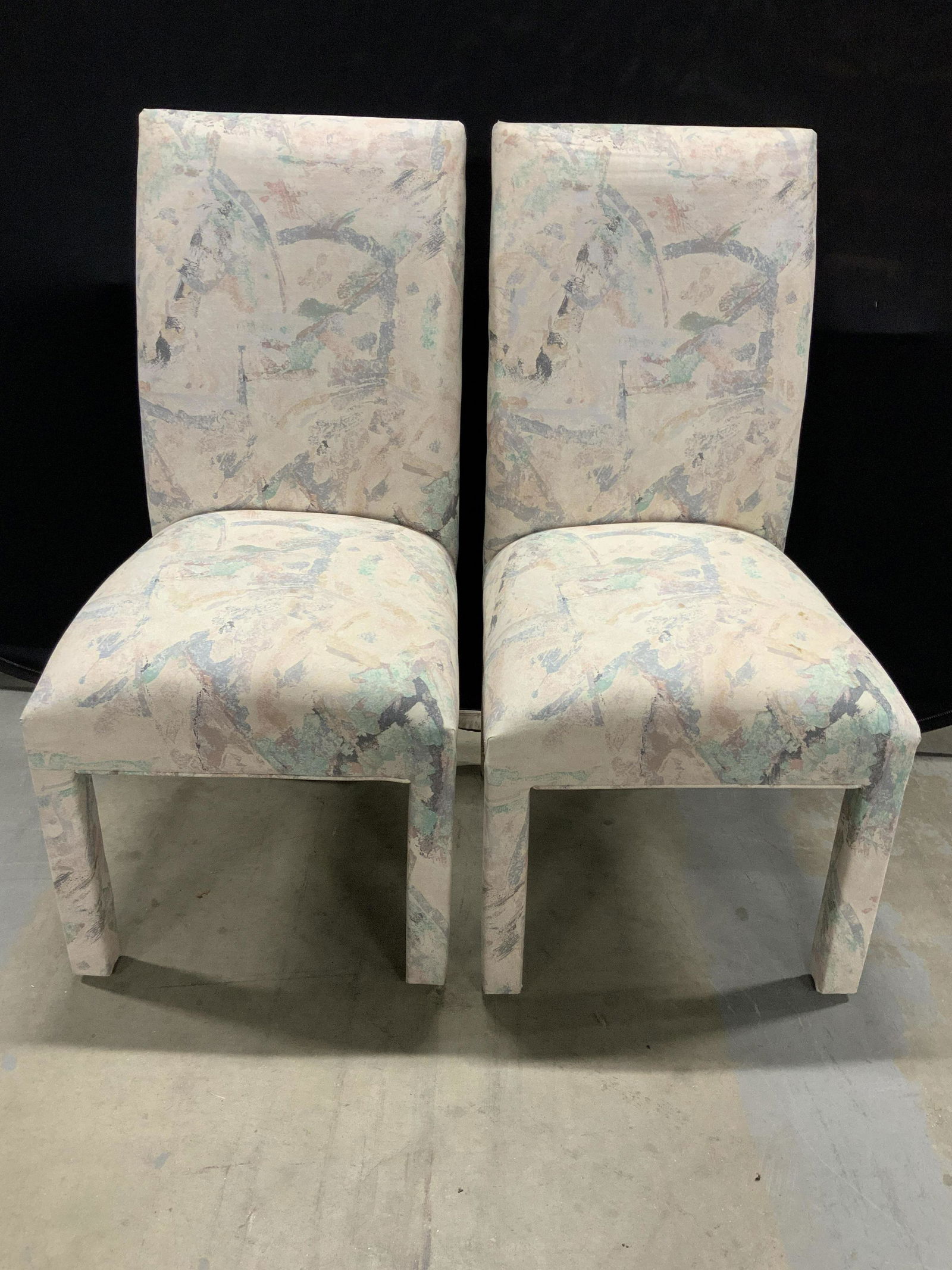 Set 4 Vintage Upholstered Dining Room Chairs: This is a set of four upholstered dining room chairs. The upholstery on each of the chairs covers the back, seat and legs of the piece. The chairs measure approx 38.75 inches H, 19.5 inches W, and 20.