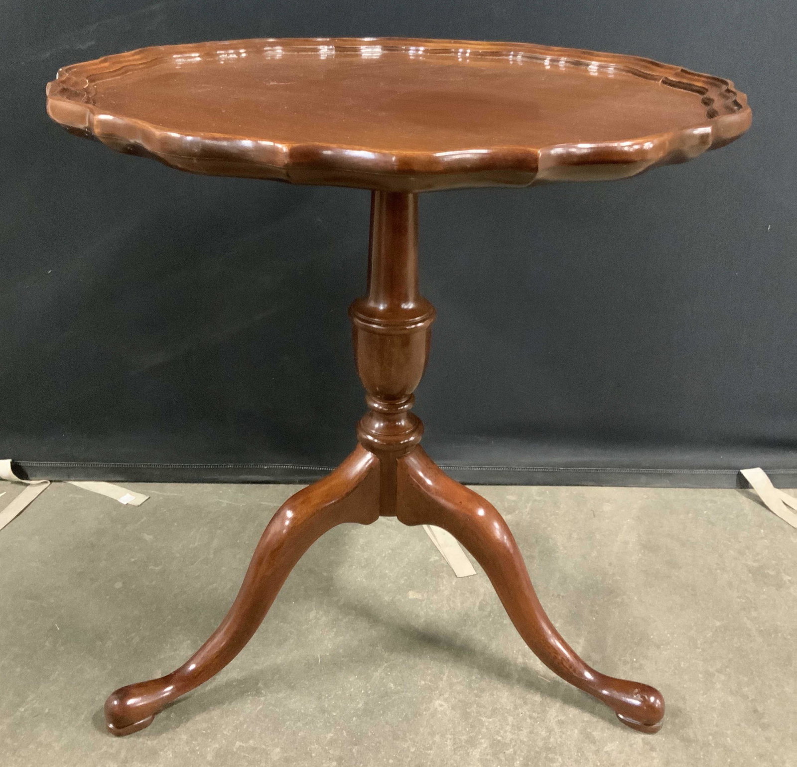 COUNCILL Carved Wooden Pie Crust Table: Table has pie crust edge at top. Piece tripod style pedestal base. Tag on underside of tabletop reads COUNCILL. Piece crust table, wooden table, COUNCILL table, wooden pie crust table. home furnishing