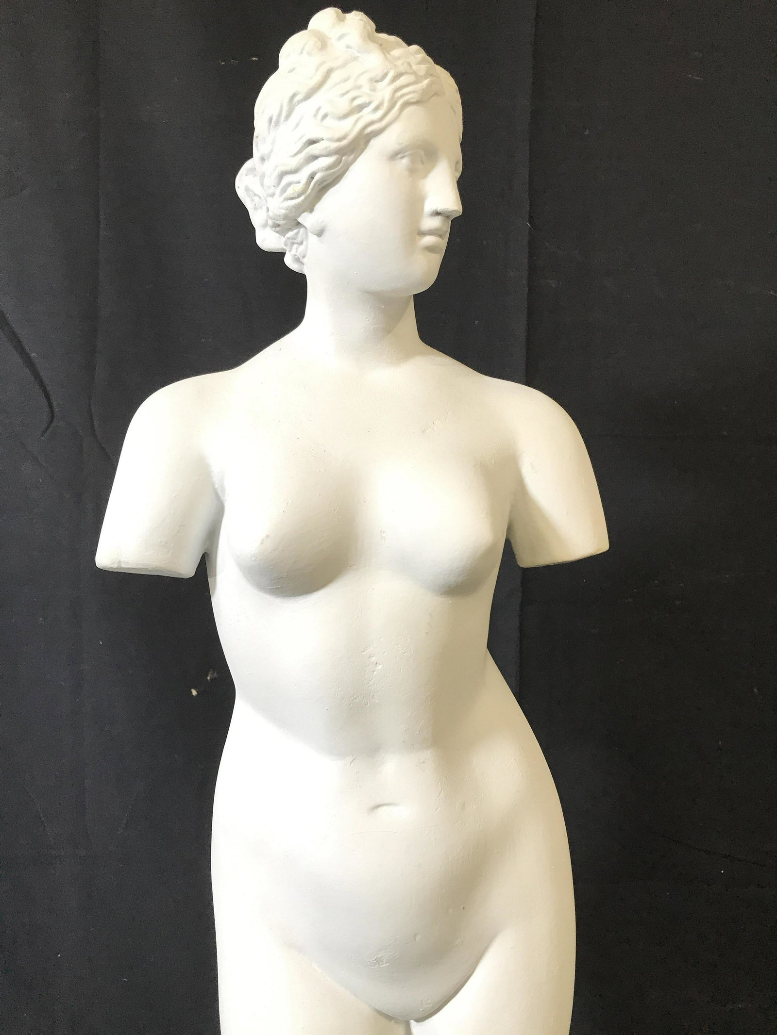 Vntge Plaster Greek Female Nude Sculpture C 1930s: Sculpture depicts an armless female nude figure. Piece is vintage and white toned. Appears to be plaster. Greek Sculpture, female Nude, female Nude Sculpture, female Sculpture. Sculpture has label on