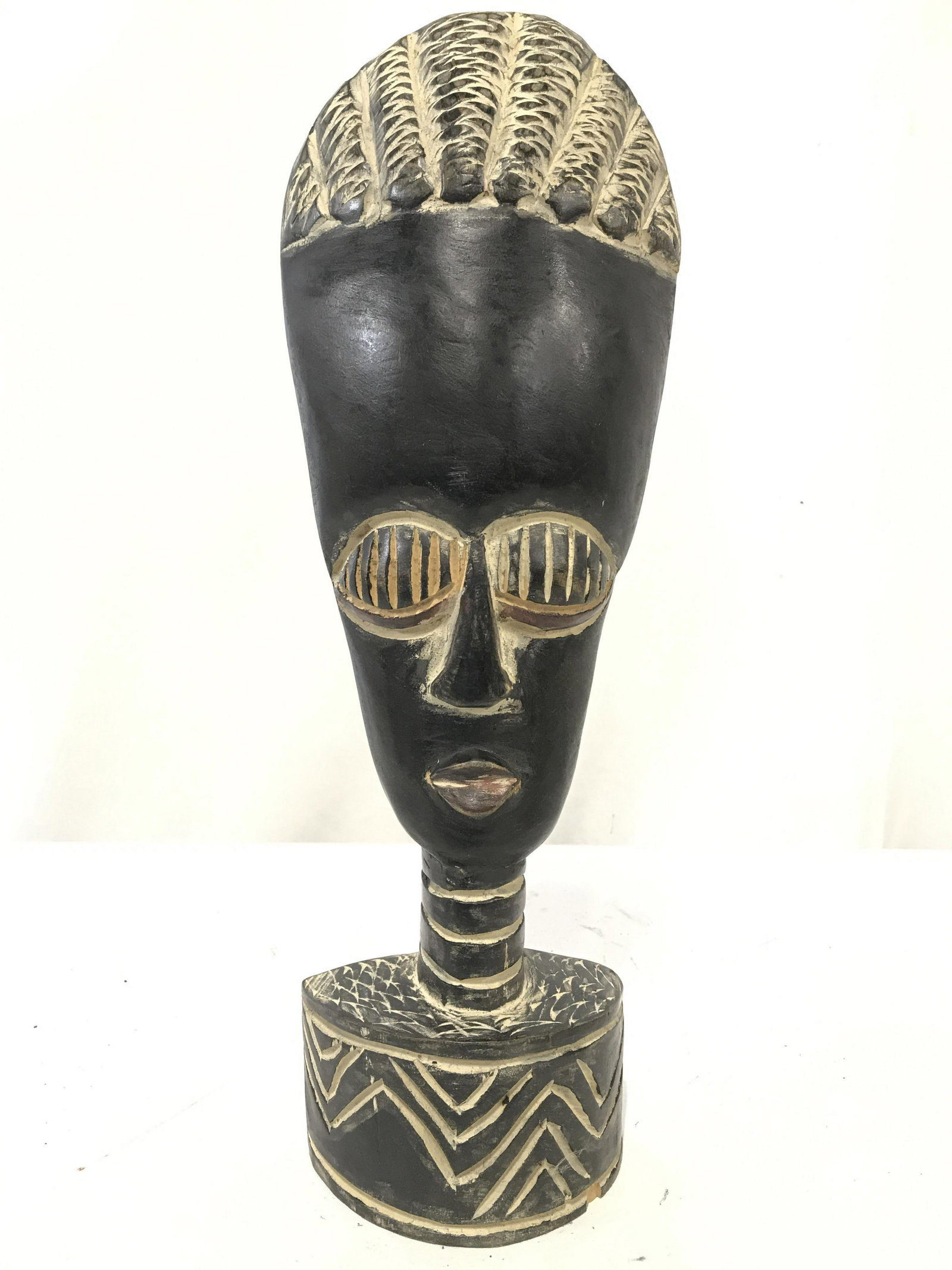 Vintage Carved Wooden African Sculpture: Sculpture in wooden. Piece appears to be vintage POSSIBLY antique. Piece appears to be hand crafted & hand carve. Piece measures approximately 15.5 inches tall 5 inches wide 2.5 inches deep. African S