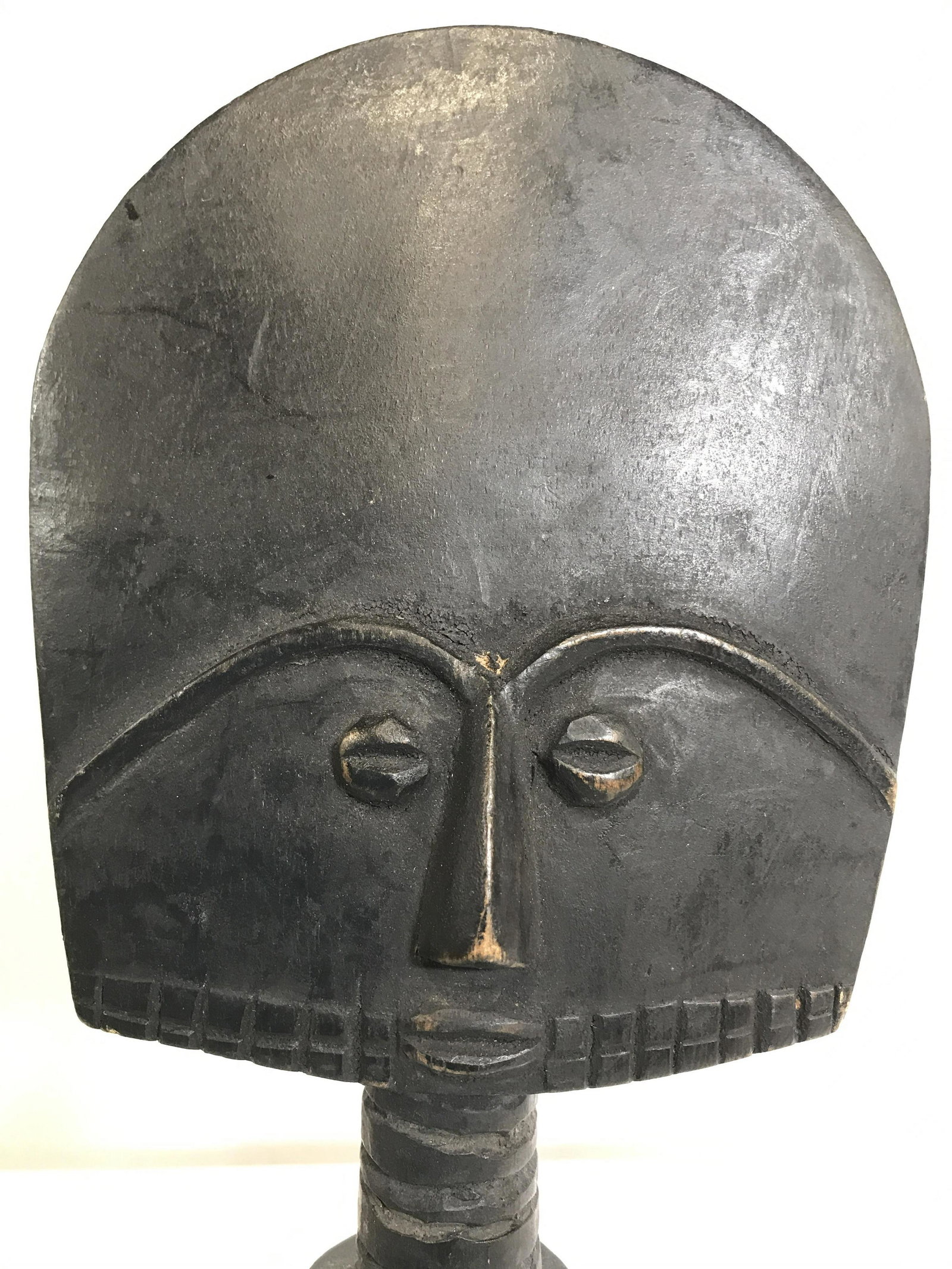 Vintage Carved Wooden African Sculpture: Sculpture in wooden. Piece appears to be vintage POSSIBLY antique. Piece appears to be hand crafted & hand carve. Tag on underside reads HANDCRAFTED IN GHANA. Piece measures approximately 16.5 inches 