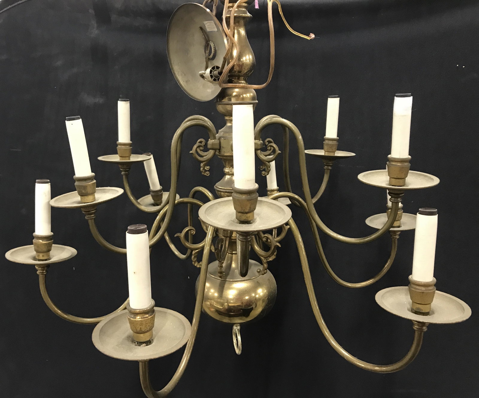 Vintage Grand 12 Arm Brass Ceiling Chandelier: Large brass chandelier, 12 lights, includes brass ceiling plate, simplistic scroll design, polished brass, measures 30 in. wide, 29 in. long. Ceiling plate 5.5 in. wide. Attached chain. Ceiling Fixtur