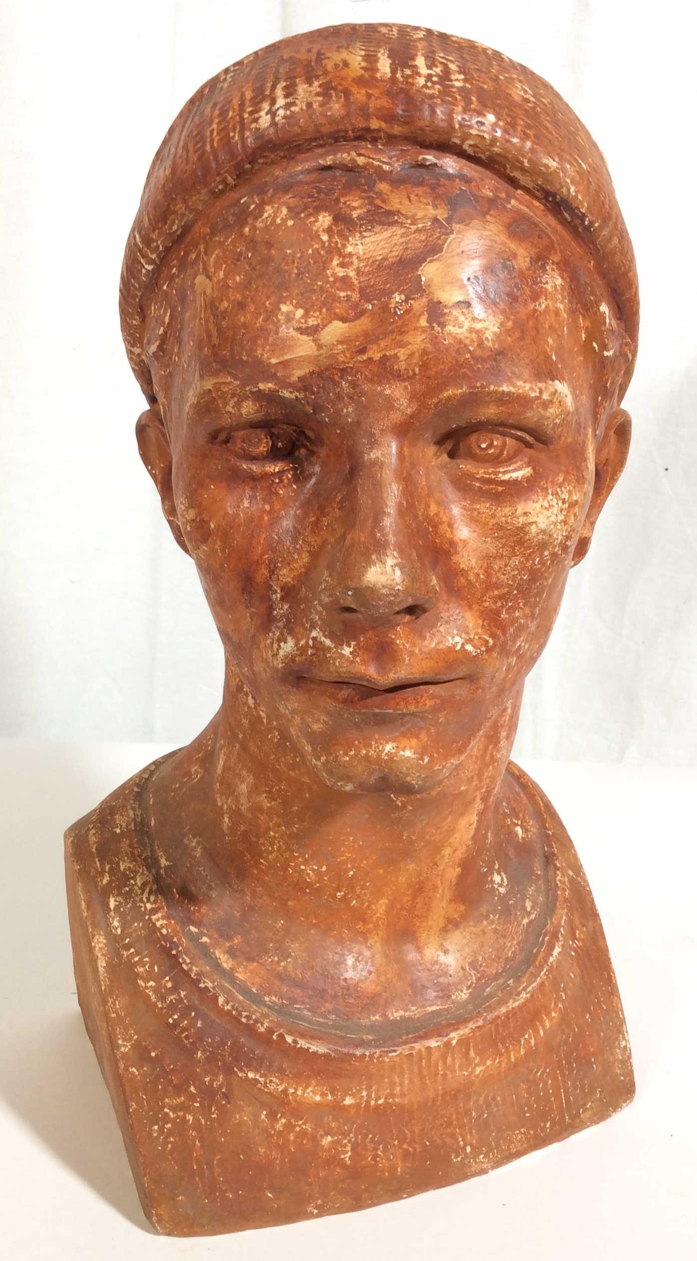 Signed Ceramic Bust WALTER HANCOCK: This is a ceramic bust. The piece and the signature found on the backside of its base WALKER HANCOCK. The piece is titled, head of a Finnish boy. The piece depicts a young boy wearing a cap. The piece