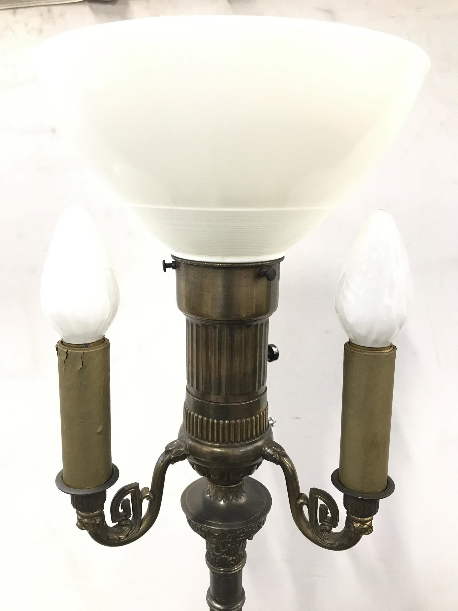 TRILITE Vintage Brass 3 Arm Floor Lamp: Label reads TRILITE ARTISTIC LAMP MANUFACTURING CO. Floor lamp is gold toned. Piece appears to be brass. Lamp is vintage possibly antique. Base is round, contains ornate detail. Piece has 3 Candlestic