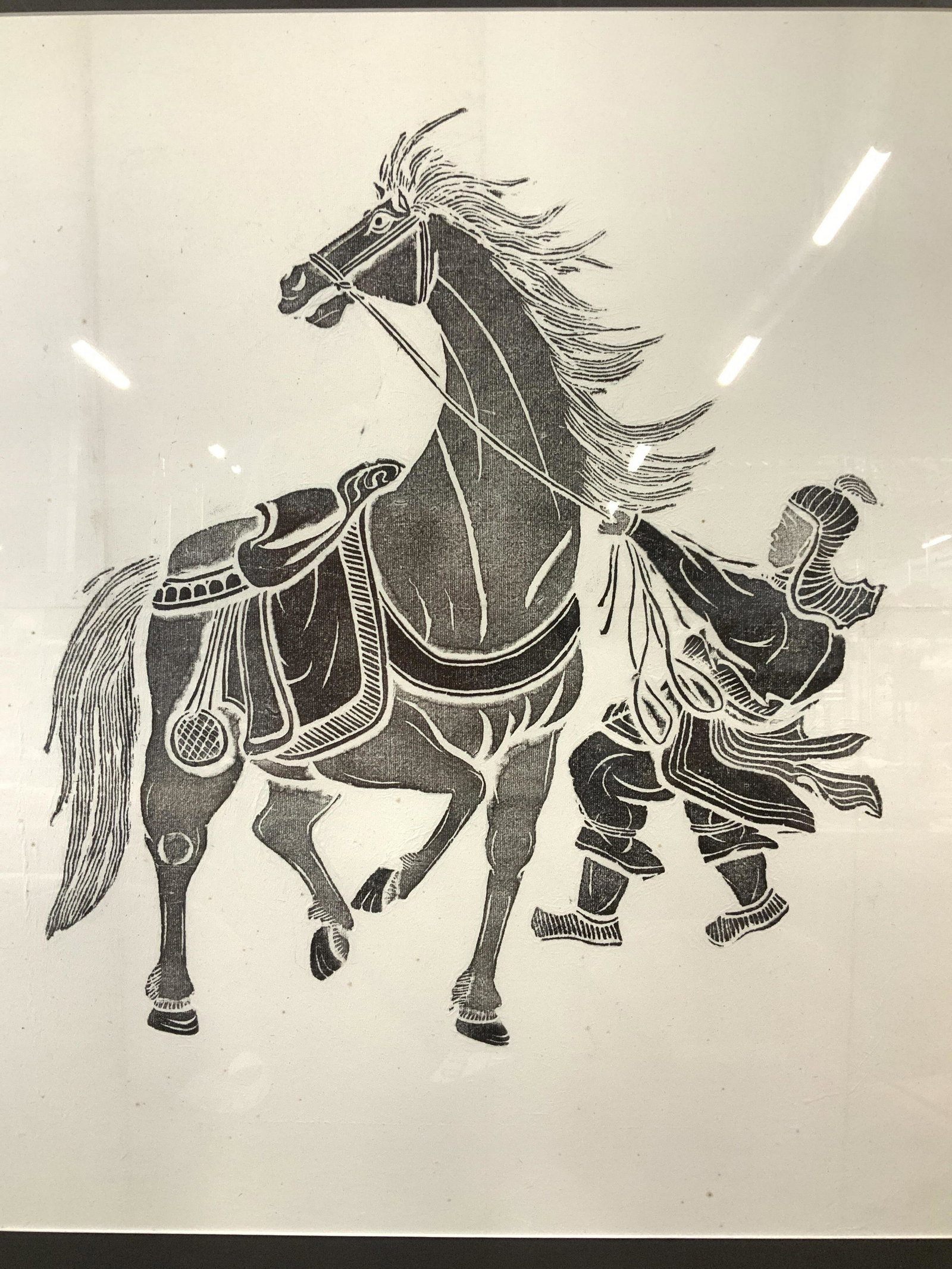 Mongolian Warrior With Horse Print: Mongolian Warrior with Horse possibly Woodblock Print on paper, framed in a grey toned mat and black toned frame, some slight foxing to paper, measures approx 28 inches tall x 25 inches wide, not exam