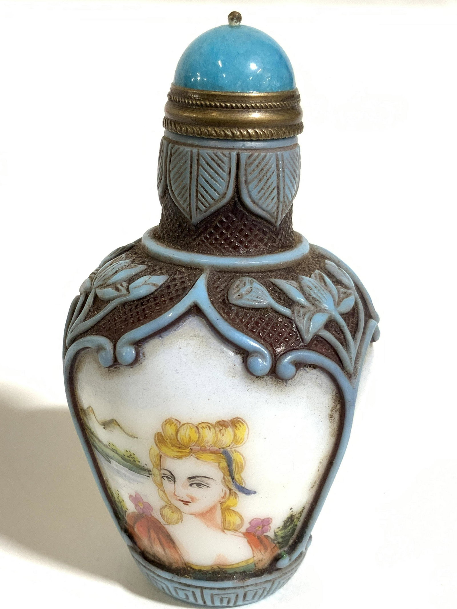 Vintage Signed East Asian Snuff Bottle: This is a vintage, possibly antique, East Asian snuff bottle. The piece is hand painted, and depicts a several blonde woman in front of waterfront vistas. The cap is crafted from brass, and stone, and