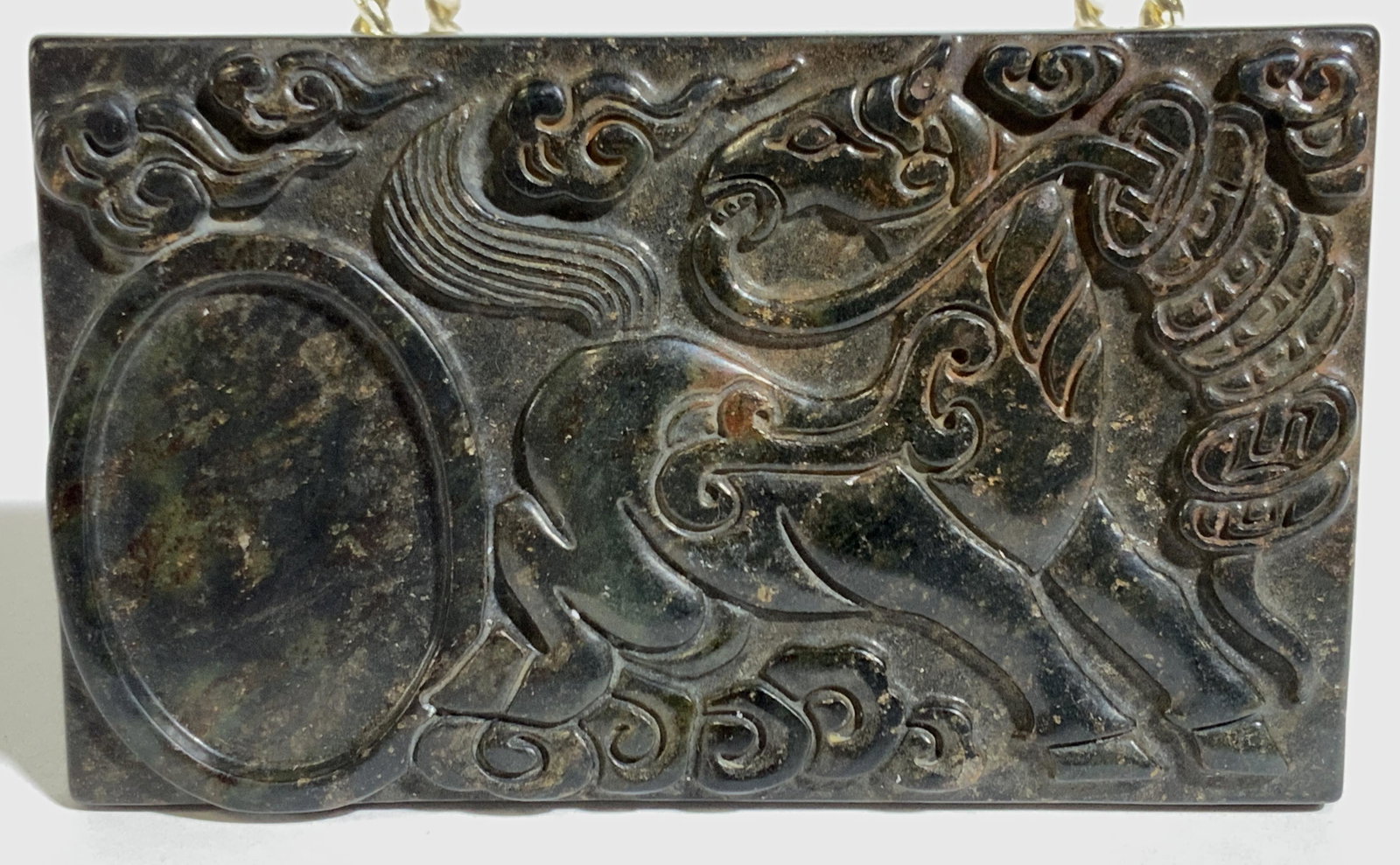 Vintage East Asian Carved Stone Tablet: This is a vintage, possibly antique, carved stone tablet. The piece depicts a horse, equipped with a saddle, kicking up dust. The piece may have been used as a palette or Inkwell originally. The piece