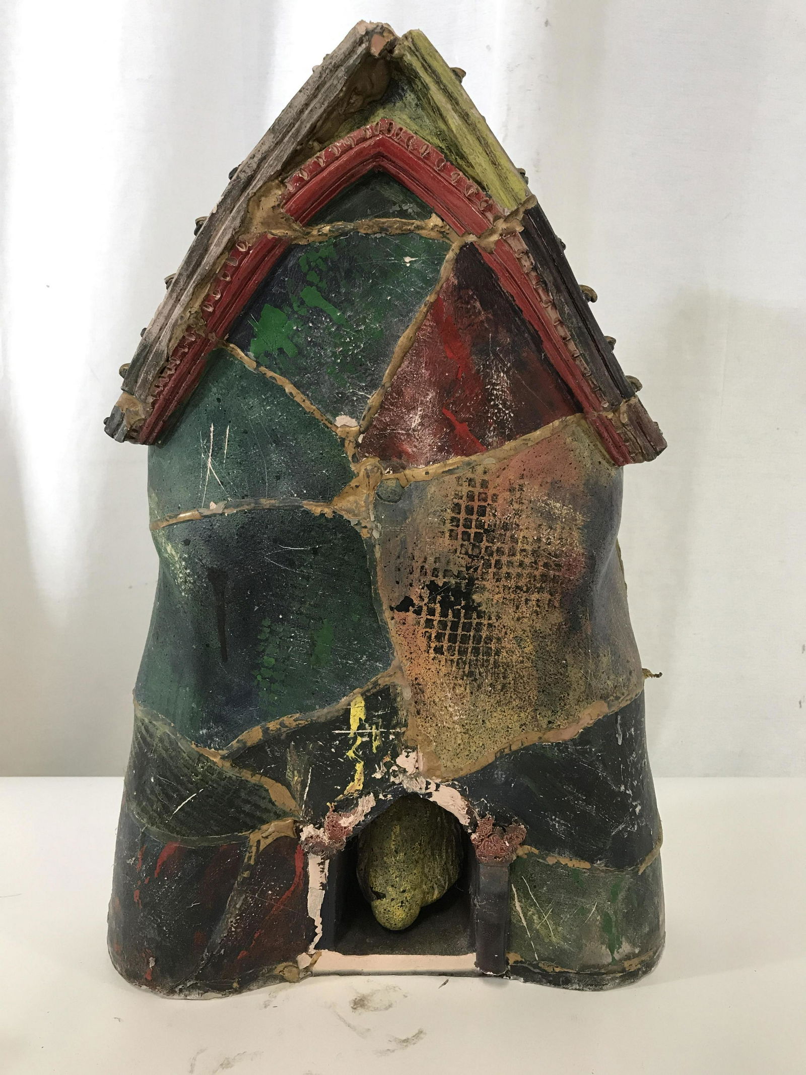 Hand Painted Terra Cotta Abstract Erotic Wall Art: Vintage piece in outward shape of a house. At closer look, human anatomy becomes the theme- depicting gorse, belly button, & a man’s genitalia. Measures app 19.5 in x 13.5 in. x 3.5 in. Pieces of ce