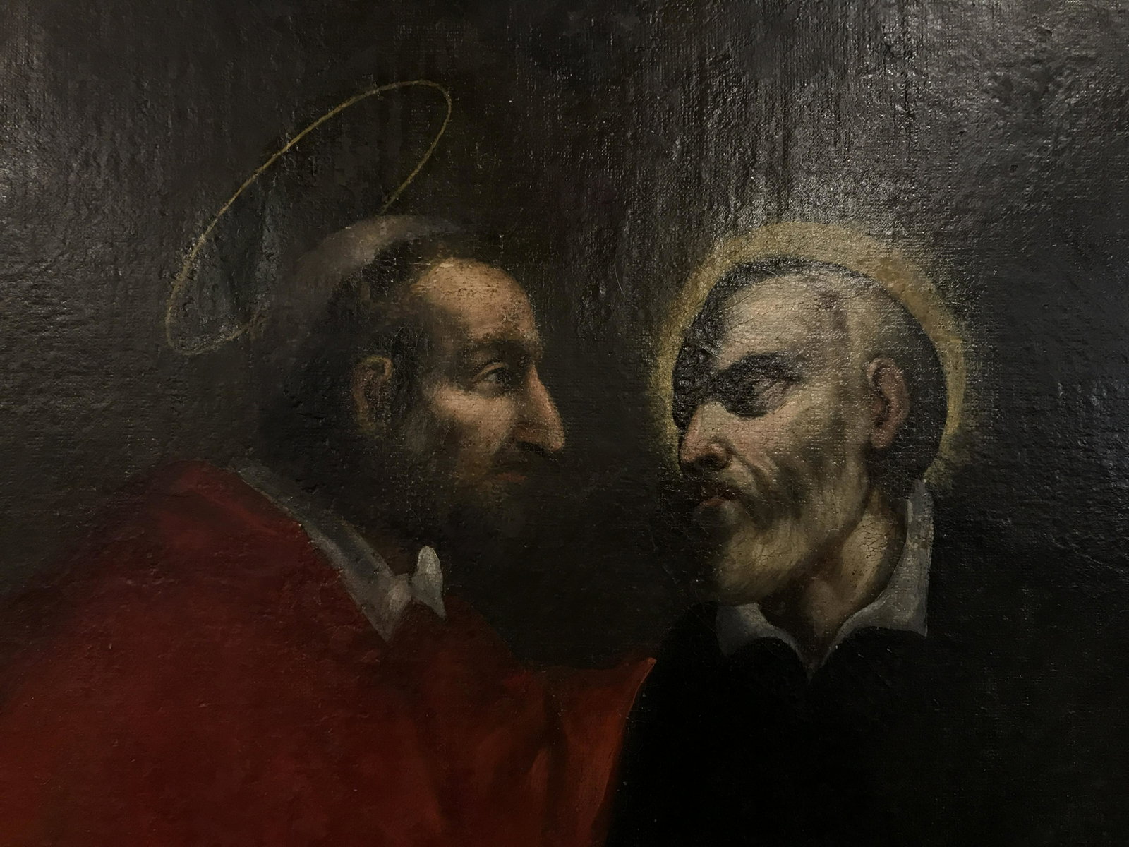 Oil on Canvas Portraits of Religious Figures: Oil on canvas possibly antique chiaroscuro painting, religious in context, Saint speaking with priest in empty space, baroque in nature, dark palette, gilt wood frame, not examined out of frame, appar