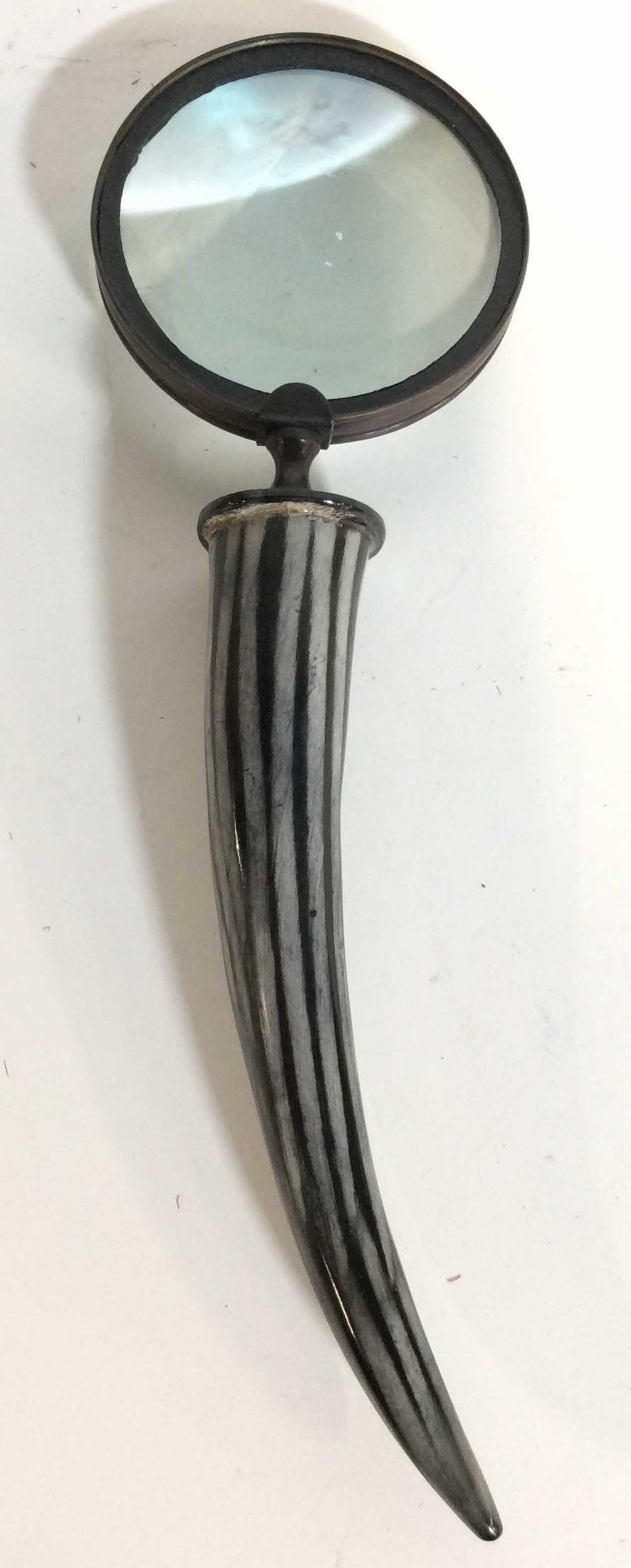 Vintage Horn Handle Magnifying Glass: Magnifying glass appears to have horn handle which has black and slate toned stripe detail. Piece measures approximately 14 inches long 4 inches wide. Magnifying glass, vintage magnifying glass, Horn 