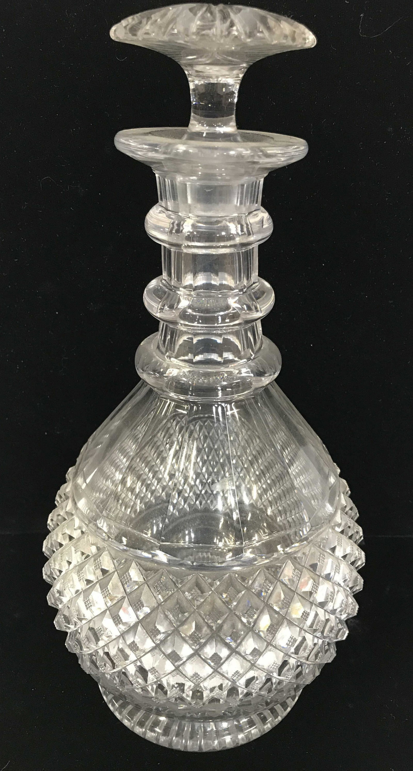 Cut Crystal Decanter w/ Stopper: Crystal Decanter, reticulated embossed diamond pattern. Chips to stopper top. Measures 10 in tall w/ stopper, 9 in w/o. 6 in. wide. Barware, Vintage Crystal Decanter & Stopper, Crystal Bottle, Liqueur