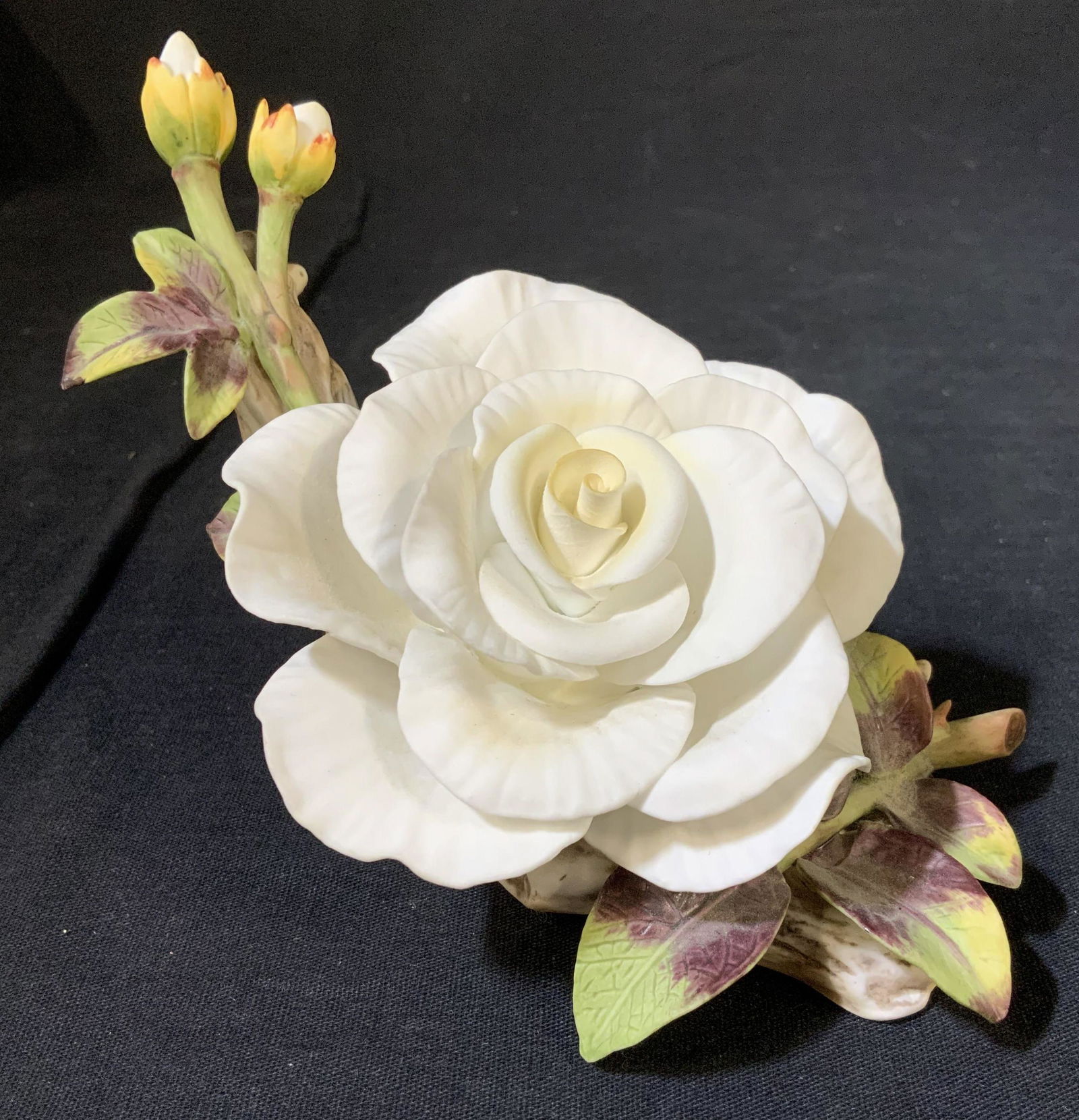 Vintage TOWLE Porcelain China Flower: This piece is a vintage porcelain flower. The piece was manufactured by TOWLE, and is crafted from bone China. The piece depicts a flower as well as buds growing from a branch. The piece measures appr