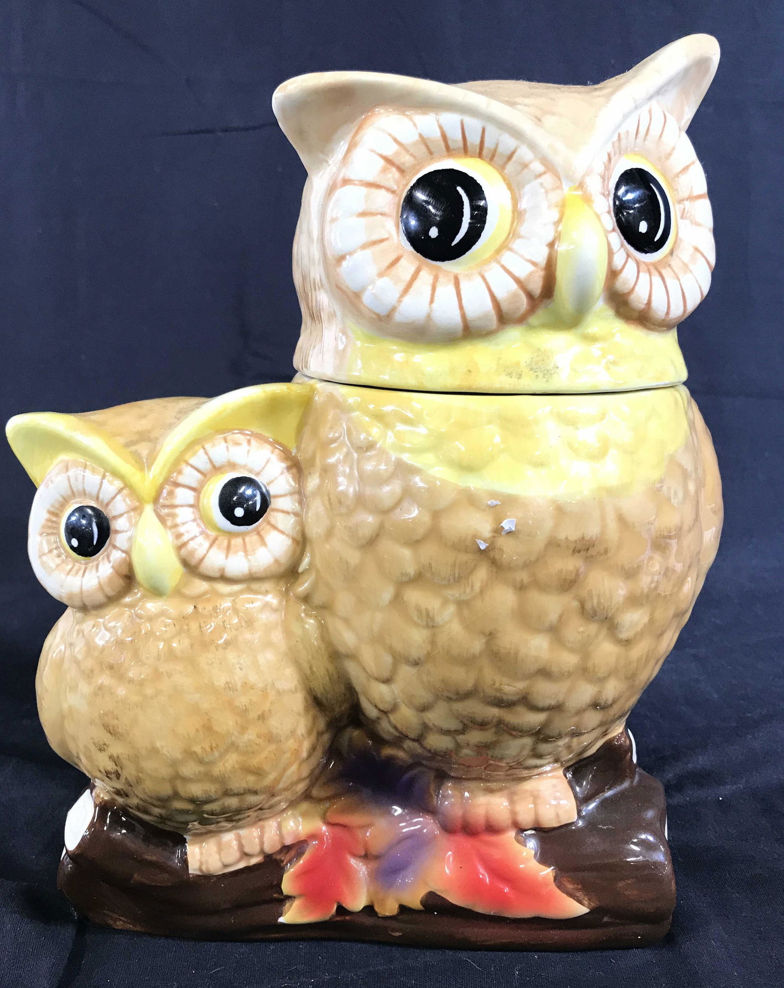 DAVIDS COOKIES Porcelain Owl Lidded Cookie Jar: Cookie jar is marked DAVIDS COOKIES on underside. Jar has shape of 2 owls perched on a branch. Head of larger owl figure acts as Lid. Piece is possibly hand painted. Piece appears to possibly be vinta