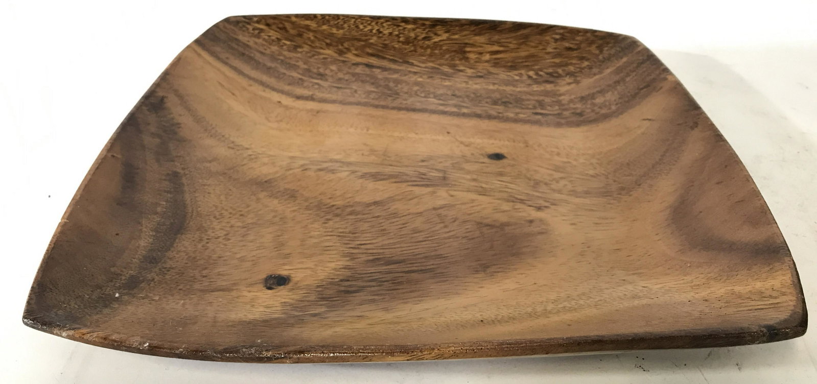 Signed Carved Wooden Serving Plate: Plate is wooden possibly teak. Piece is signed on underside. Plate has rounded square shape. Wooden plate, wooden serving plate, serving plate, rounded square plate, Signed plate. tableware, Piece mea