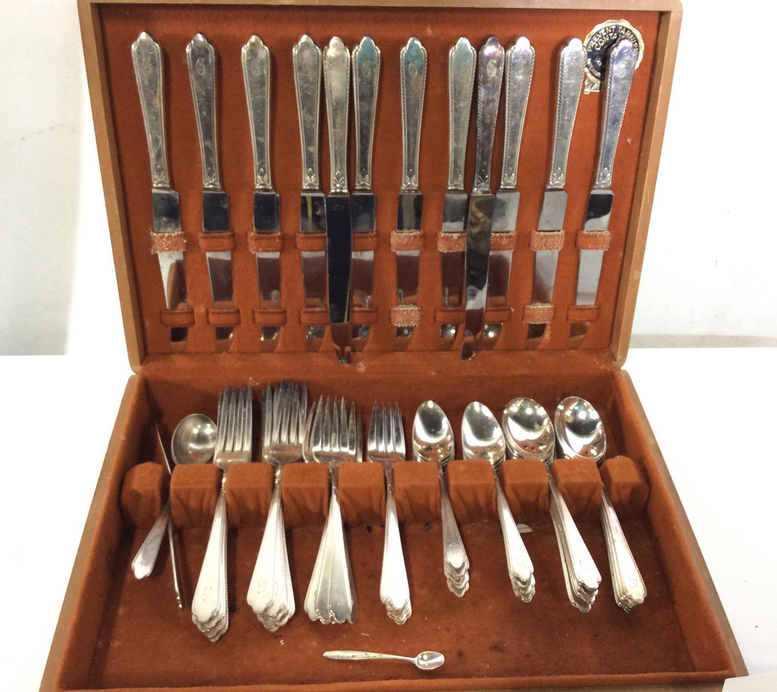 Holmes & Edwards Inlaid IS Co. Plated Flatware Set: Silver Plated Flatware with Monogrammed G on all pieces. Forks & Spoons read ‘Holmes & Edwards Flatware - Inlaid ‘. Knives read ‘INSICO Stainless’ SET INCLUDES 12 round soup spoons, 12 sugar s