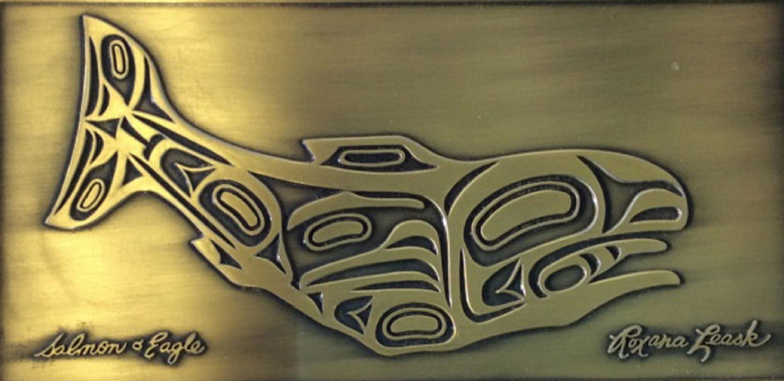 Collectible Signed Sperm Whale Art, Roxana Leask: Native American Design. Embossed brushed brass toned Metal art piece, called Salmon Eagle. Woodland Style with metal art. . Signed Roxana Leask. Cherry Wood Frame around Art. Originally was the top to