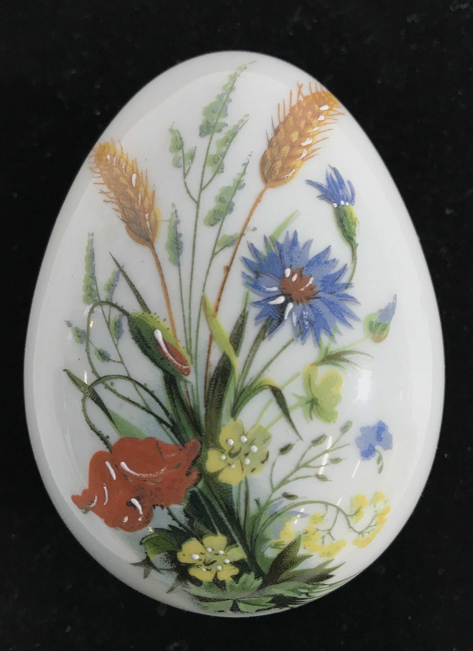 LIMOGES FRANCE Porcelain Egg Shaped Trinket Box: Trinket box is marked LIMOGES FRANCE ON underside. Piece has floral and leaf detail, possibly hand painted. Piece has gold toned accent detail piece measures approximately 4 inches long 2.5 inches wid