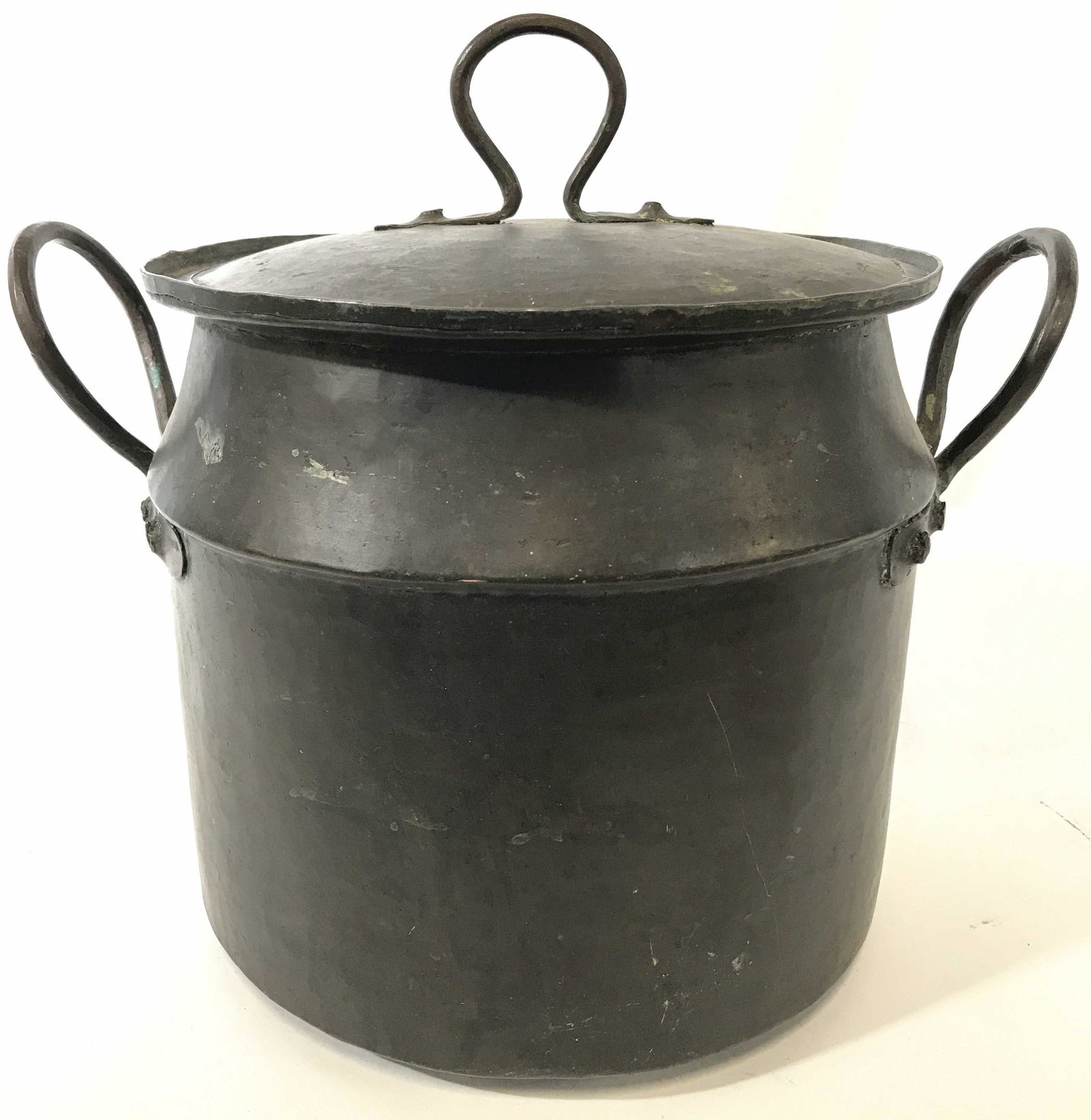 Antique Handled Lidded Metal Pot: Pot is antique. Piece is metal possibly copper. Piece has dark chocolate tone. Piece includes lid with handle. Pot has 2 metal handles. Piece measures approximately 10.5 inches tall 12 inches wide wit