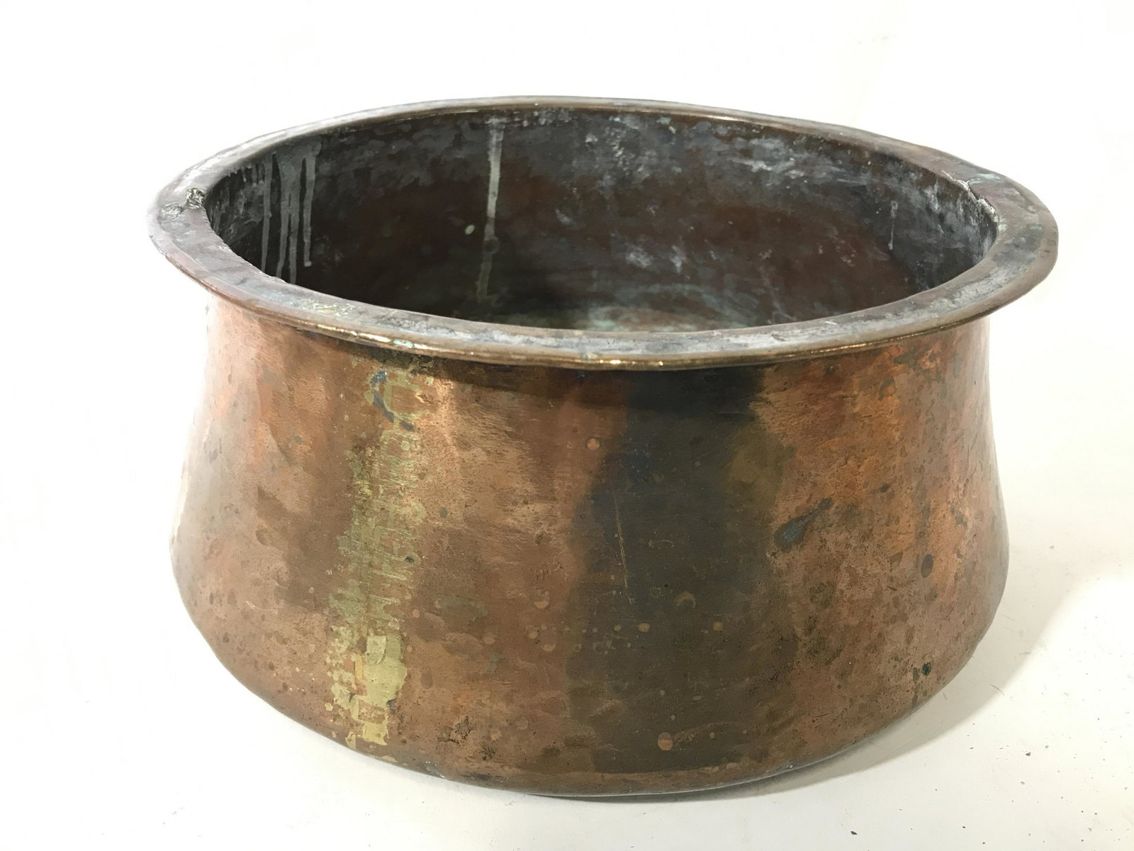Round Antique Copper Pot: Pot is antique and copper. Piece appears to possibly be hammered copper. Copper pot, antique copper pot, antique kitchen accessories, round copper pot. Piece measures approximately 10 inches wide 5 in
