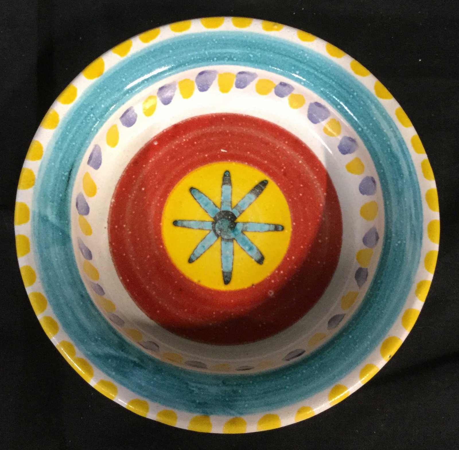 Signed Stoneware Ceramic Sunburst Dish: Appears to be signed Desimane, 21. Colorful tones of reds yellows and blues, Sunburst center. Stoneware pottery, ceramic bowl, Tableware, tabletop decor. 4