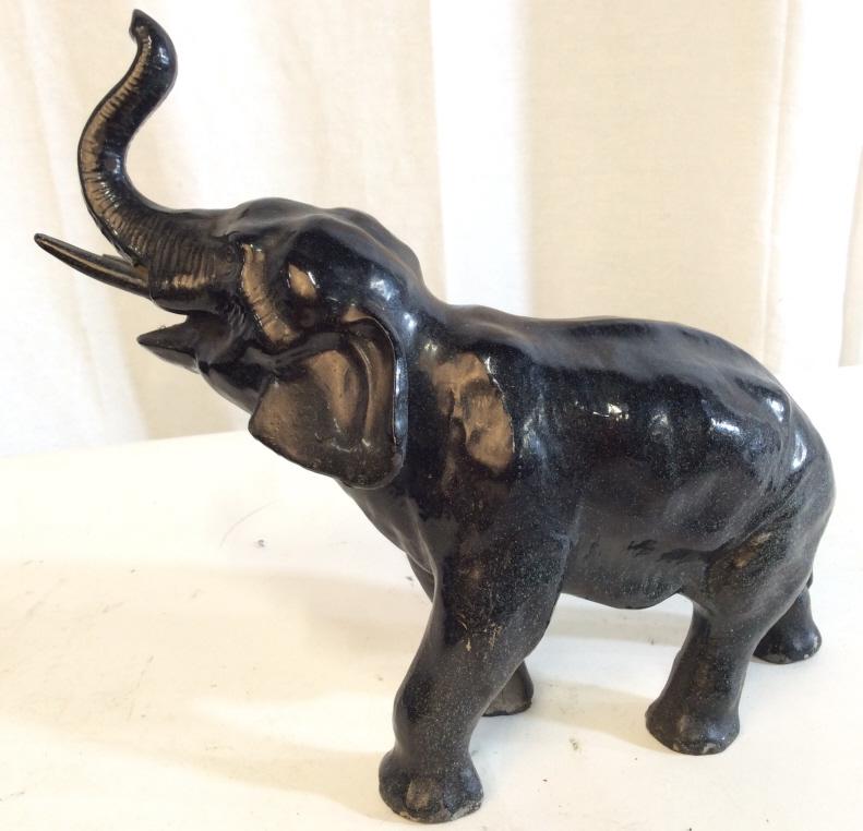 Black Toned Metal Elephant Figural: Elephant Figural is black toned and metal. Elephant statue, elephant sculpture, elephant figure, elephant Figural, animal sculpture. Piece measures approx 9.5 inches long 8.5 inches tall animal figura