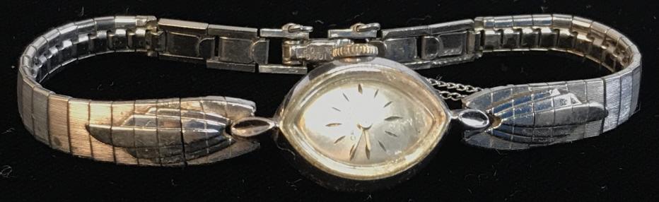 Lot 2 Vintage Women’s Wristwatches: SEIKO, Gold Toned Metal. Made in Japan, scratched glass face, measures app .5 x 5/8 in. Length is app 5.5 in. CROTON 10 K white Gold Bezel Wristwatch with Stainless Steel backing. Reads ‘ 10K R.G.P.