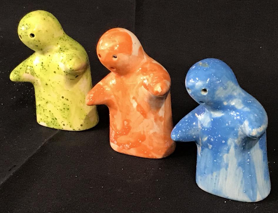 Signed Ceramic ‘Ghost’ Salt & Pepper Shakers, 3: Set of 3 Hand Painted Blue, Orange, & Green Ceramic Figural Shakers. Two signed ‘AA’ on underside. Plastic stopper, green has 2 holes, others have 3. Glaze over paint. 3 x 2 x 1 3/4 in. No surface
