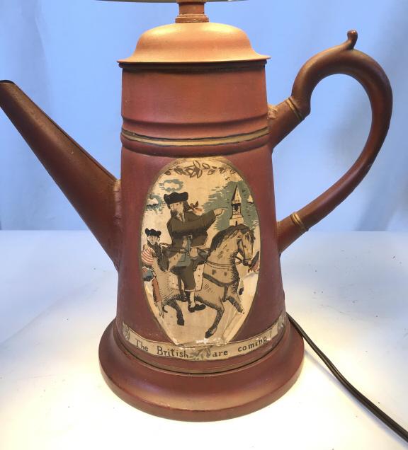 Vntg.Toleware Tea Kettle Lamp, Revolutionary Motif: 3 way lamp. Brink red patina on metal kettle with gold paint simple line detail. Decorative Print on surface reads ‘The British Are Coming!’ and two men on horseback pointing to Boston's Old North