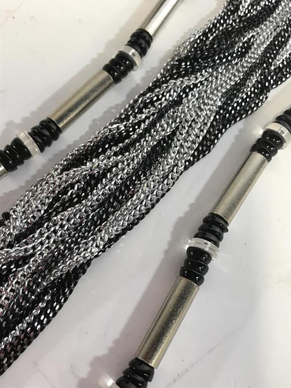 Black and Silver toned Fashion Necklaces: Lot 2. Silver Toned Beads with rounded black and clear acrylic disc beads. Bold for the strong minded lady. 30 in. Multi strand drape chain necklace. Silver tone and metallic grey, embossed snap clasp