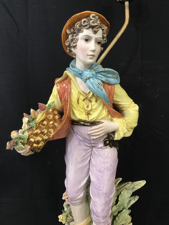 Vintage 2 Feet Tall Capodimonte Youth Figural Lamp: Vintage 2 Feet Tall Capodimonte Ceramic Youth Figural Lamp, Lamp not tested, arm holding basket has missing pieces, pieces attached in a plastic bag, some chips to gold toned painted edges and chips t