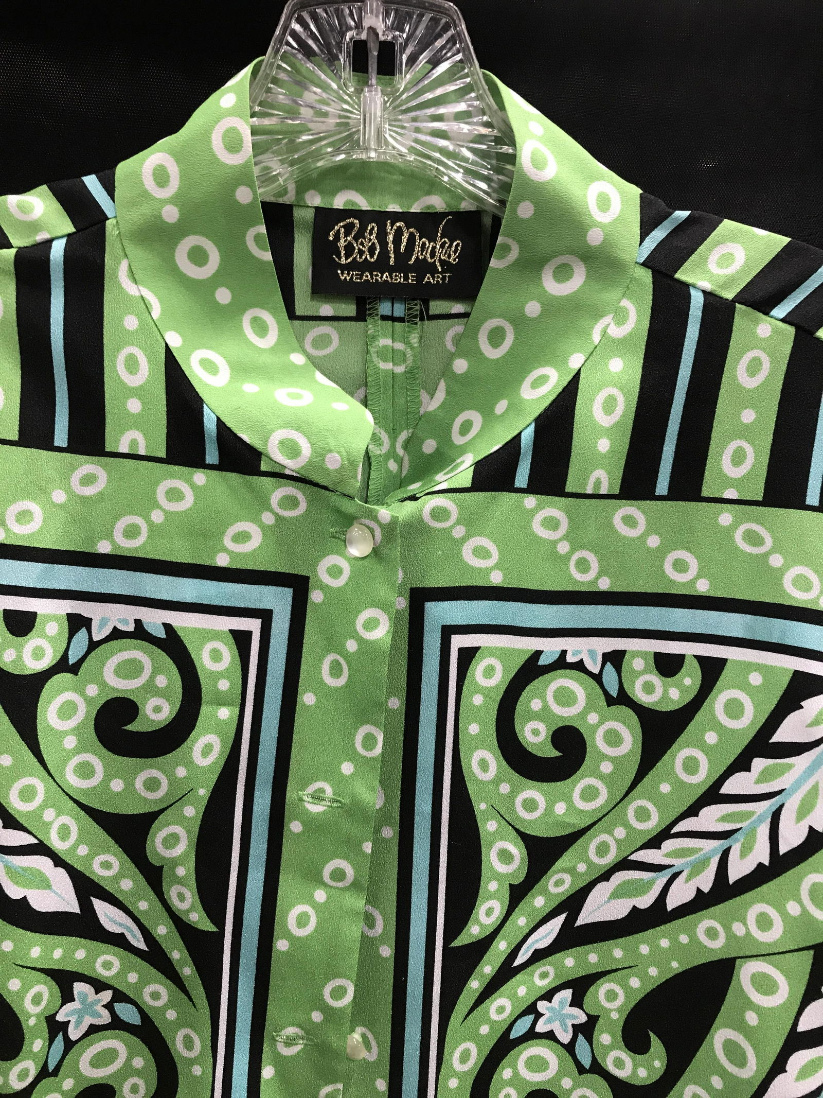 Bob MACKIE Wearable Art Scroll Design Blouse, M: From Bob Mackie’s High end ready to wear collection- blouse-grass green color accented with black & white. Size M Blouse, Polyester. Button down. Length 28 in. Crew neck. No fabric issues. Property