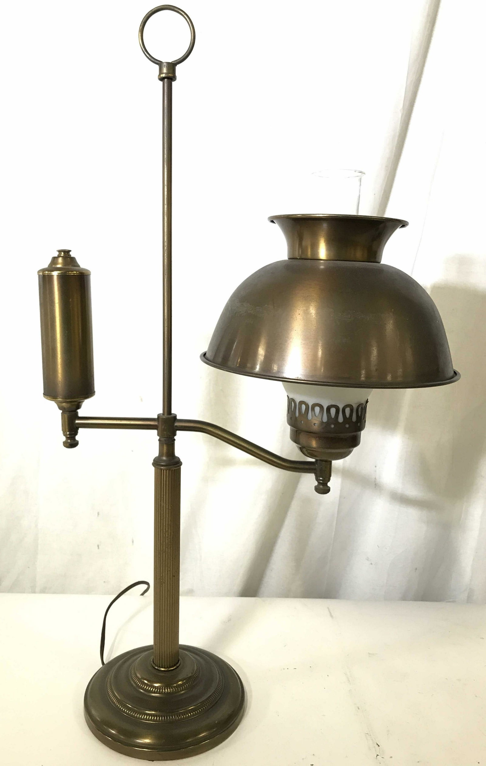 Gold Toned Brass Table Lamp W Hurricane Glass: Lamp is gold toned and brass. Piece has circular base. Shade has open dome shape with hurricane glass. Piece measures approximately 28 inches tall 17 inches wide. home lighting, office lighting, home 