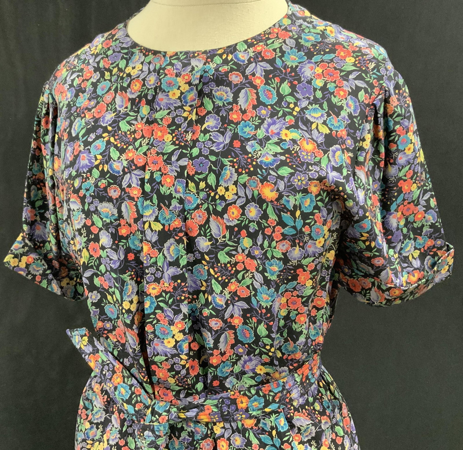 Vintage Neiman Marcus Silk Floral Dress, sz 6: Over the head style dress, 100% silk, with original store label, short sleeve, added belt ( use or not use) , lightly tuft sleeves and waist. High collar crew neck, 39 in. long. Slenderizing. Boutique