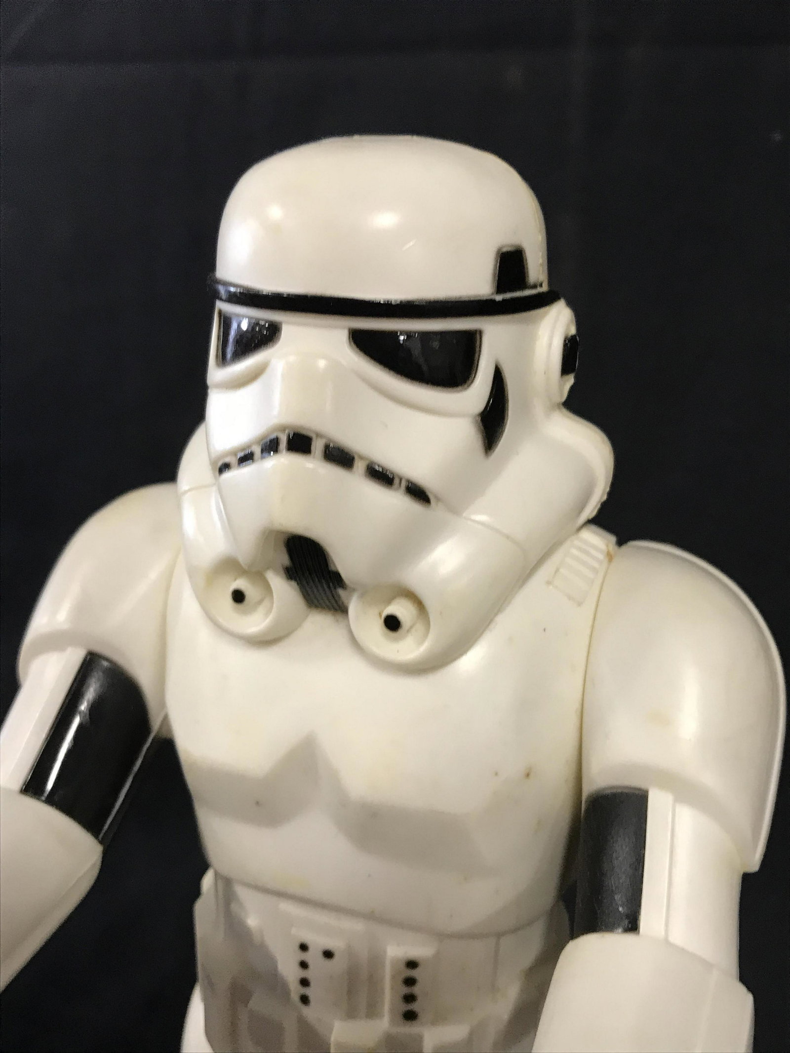 Vintage Storm Trooper STAR WARS Action Figure: This is a vintage STAR WARS Storm Trooper action figure. The figure includes a rifle. The piece measures approx 12 inches H and 4.5 inches W. There is wear present on the piece consistent with age and