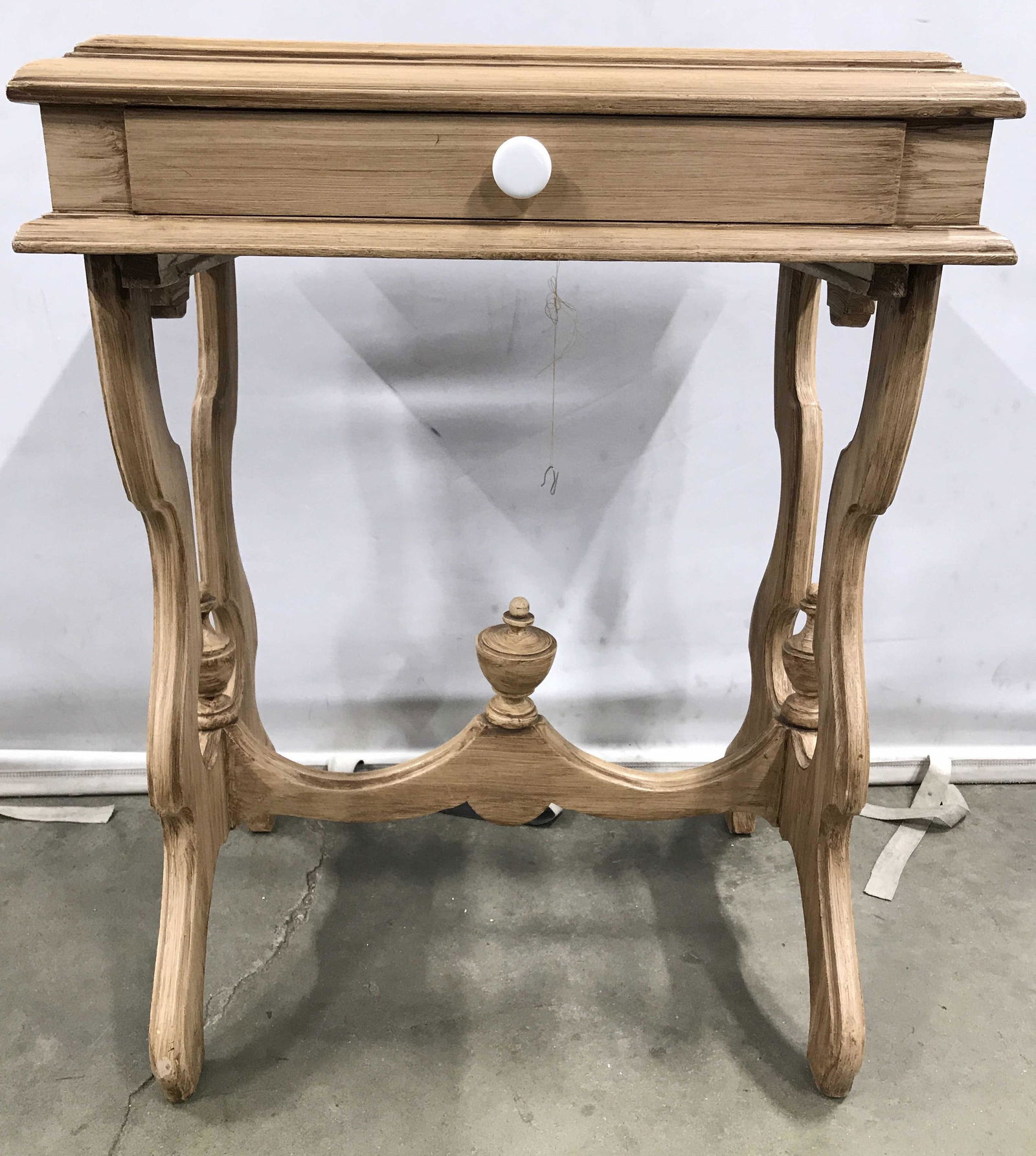 East Lake Carved Wooden Side Table W Drawer: Side Table is wooden. Piece is possibly a sewing table. Piece has east lake style. Piece has 1 drawer with white toned knob style handle. Side table, end table, wooden table, sewing table. Piece measu